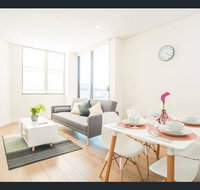 Gorgeous modern brand new two bedroom apartment with large lounge and private garden view balcony - Foster Accommodation