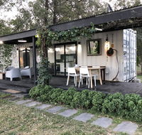 Absolute riverfront shipping container cabin - Foster Accommodation